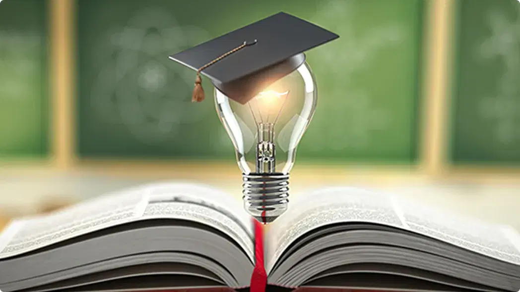 本の上に電球が載っている画像